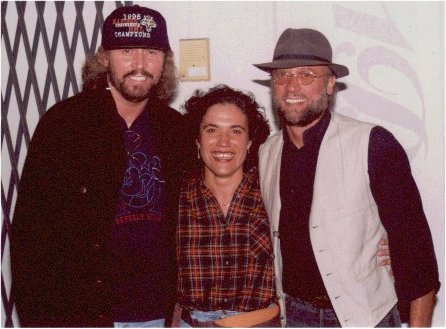 With the fans (446Wx329H) - Barry & Maurice Gibb with Elisabetta Mettuno, Miami, 1997 