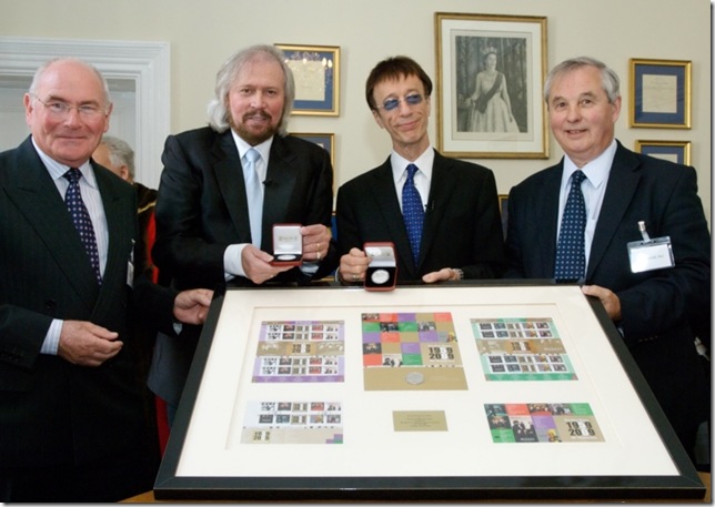 Barry & Robin receive the IOM stamps and coins