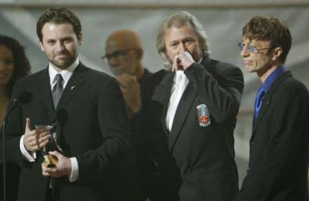 Grammys 2003 (450Wx293H) - Adam Gibb (with the Legend Grammy Award), Barry and Robin Gibb at the 45th annual Grammy Awards in New York February 23, 2003 