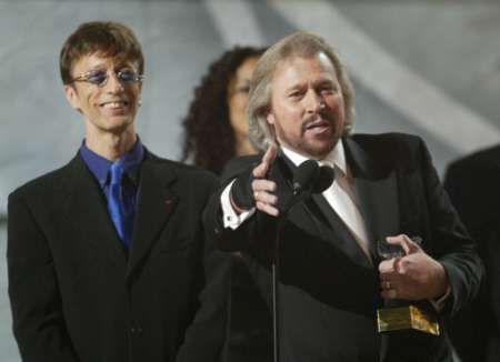 Grammys 2003 (450Wx326H) - Barry introduces Adam Gibb (the son of Maurice Gibb) at the 45th annual Grammy Awards in New York February 23, 2003 
